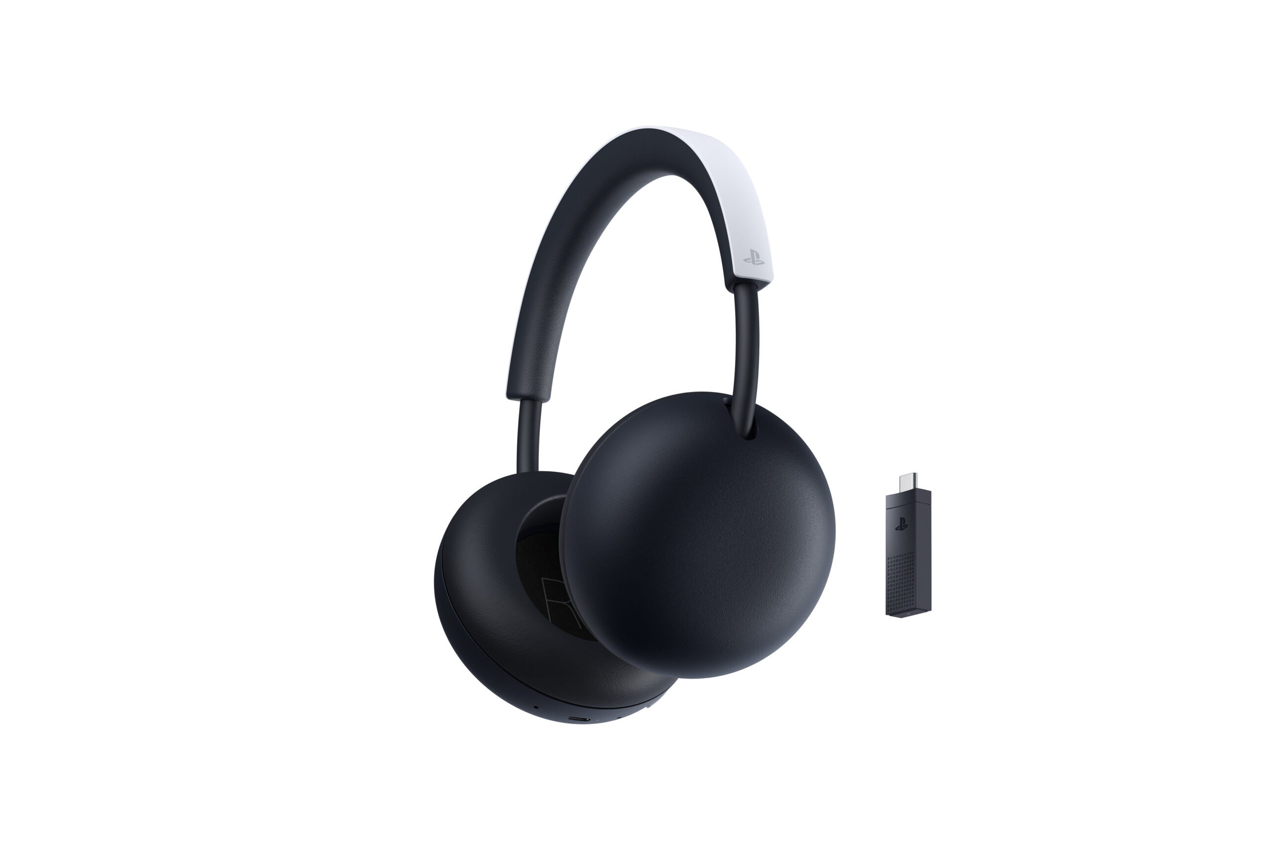 White PlayStation Pulse wireless headset beside its PlayStation Link USB-C adapter